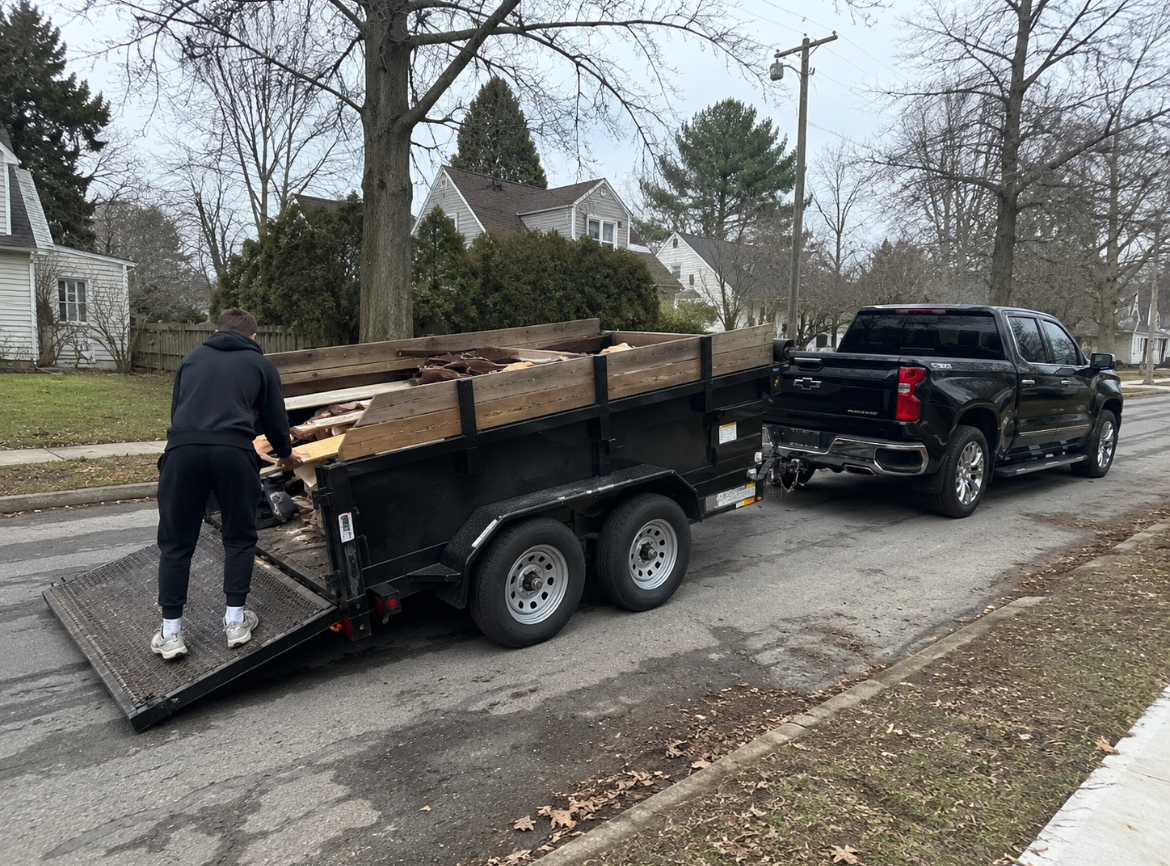 JunkKingsLI crew loading a junk removal truck on Long Island